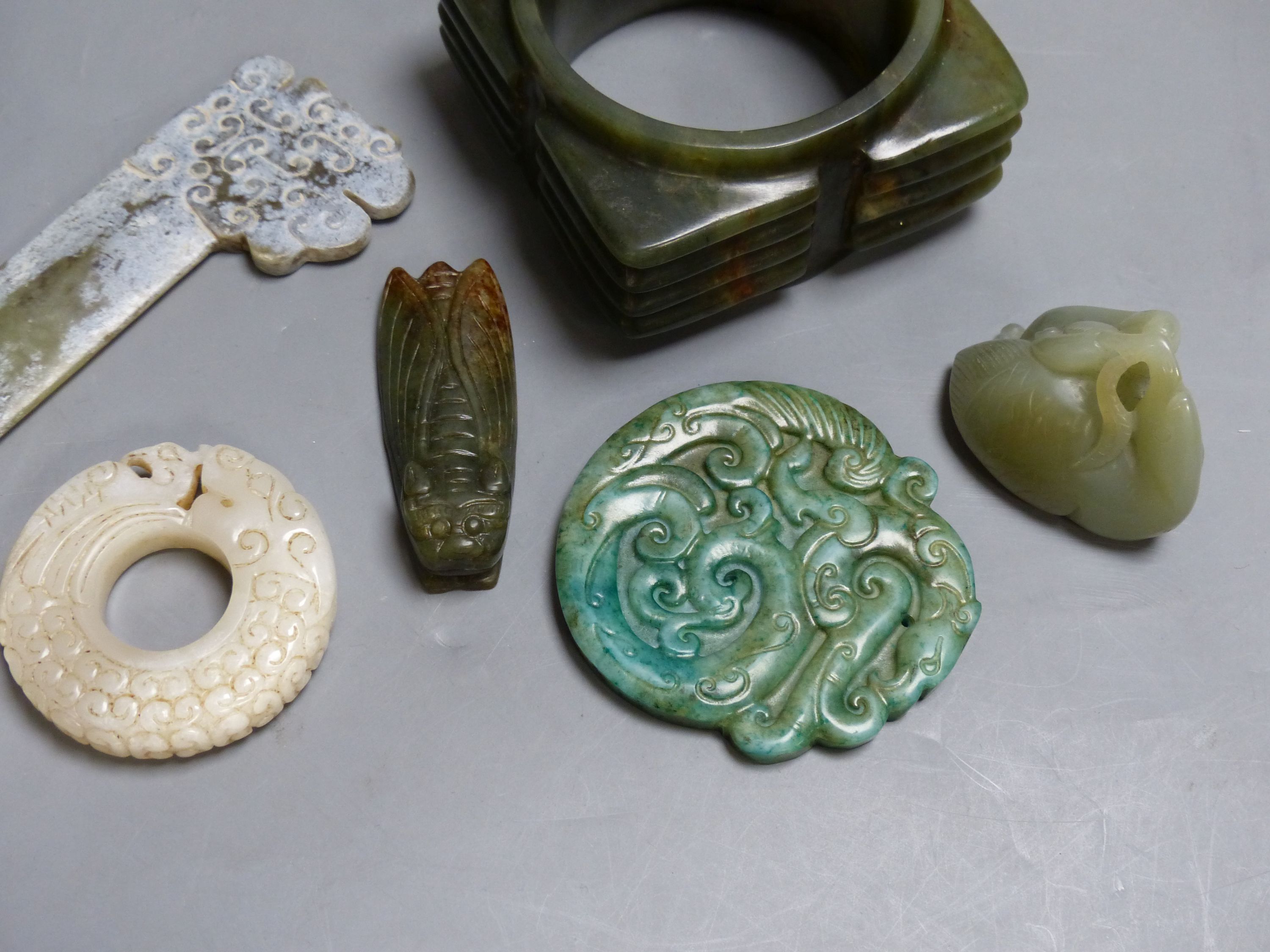 Seven Chinese jade or hardstone carvings, largest 15.5 cm